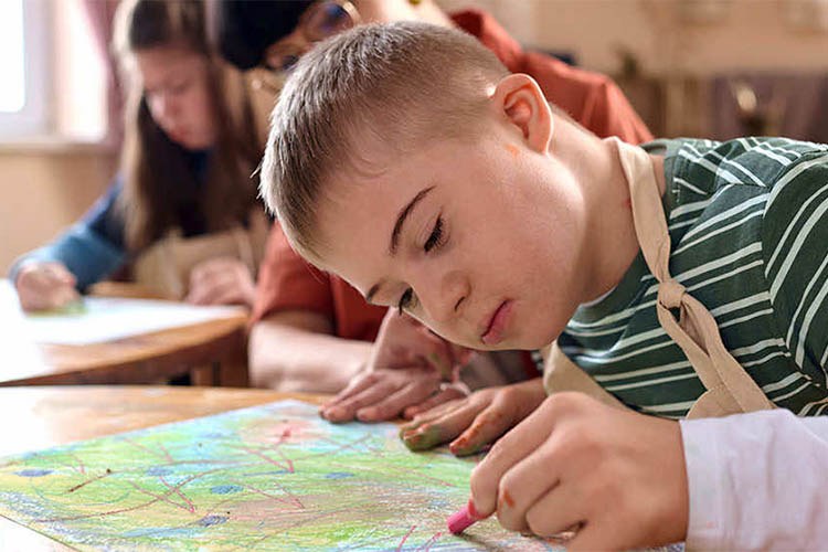 Boy engaged in an artistic activity.